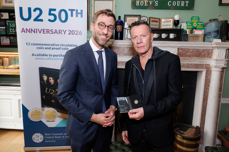 Central Bank Deputy Governor Vasileios Madouros presented the coin to Larry Mullen Jr. 