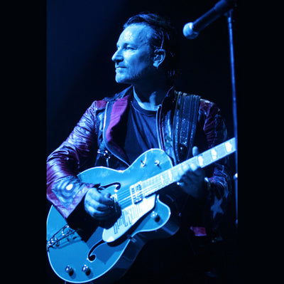 Bono playing his guitar