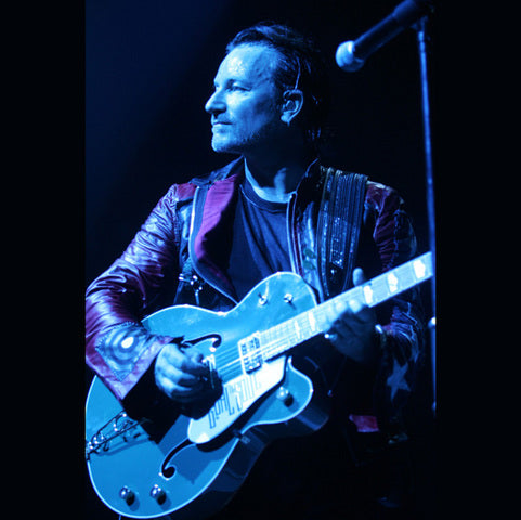 Bono playing his guitar