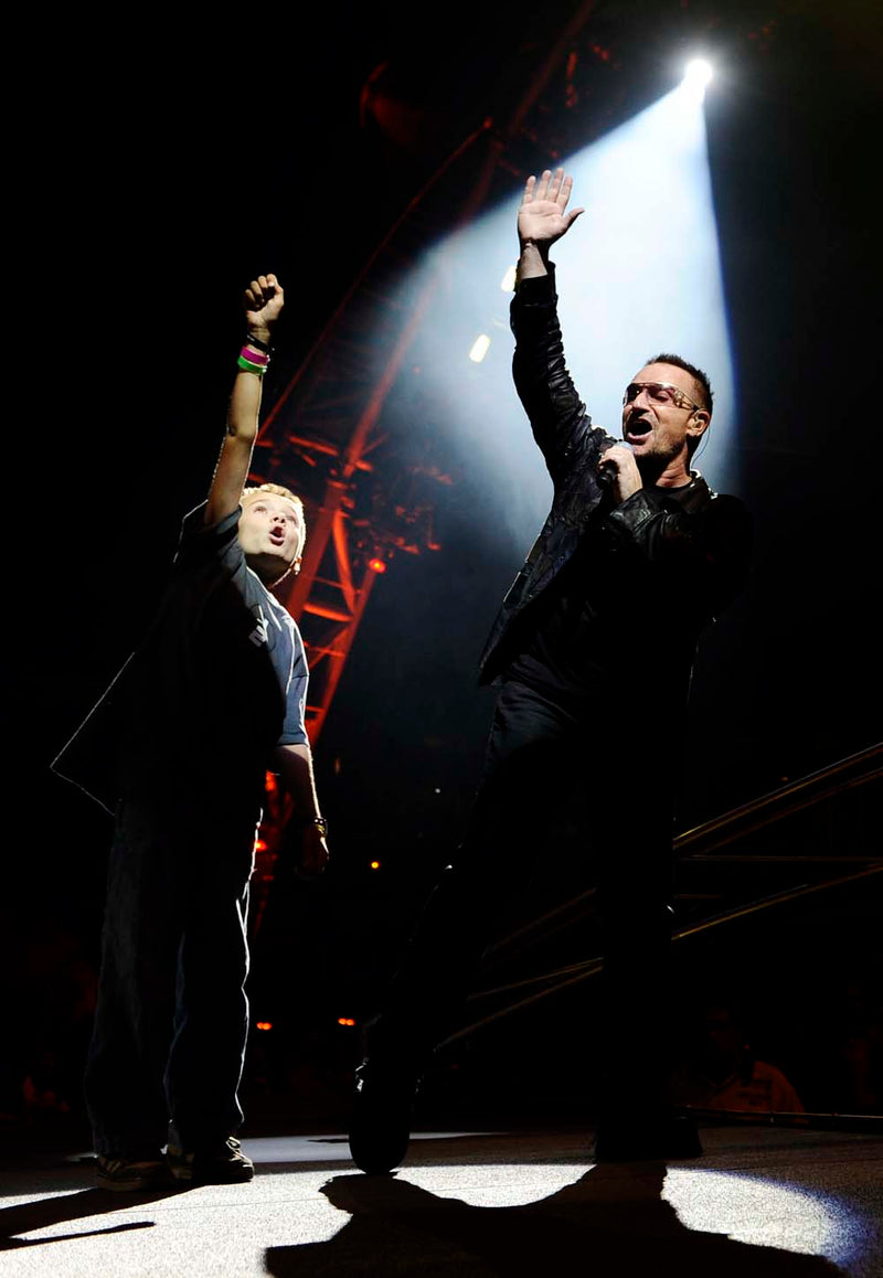 On stage with Bono