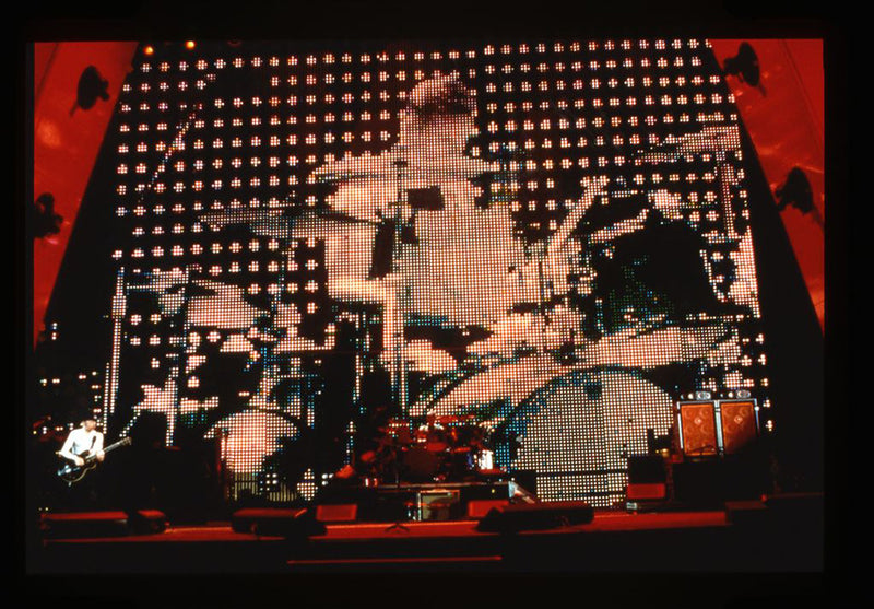 Edge on stage, Larry on screen