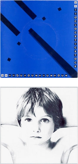 Blue album cover with black diagonal stripes and squares, featuring the text ’u2’’ vertically on the right side.